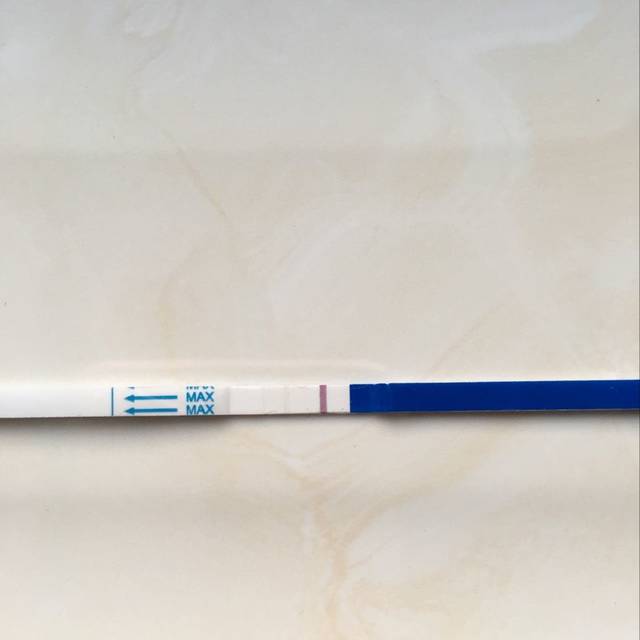 求解答_月经推迟十天用试纸试了第二条线很浅